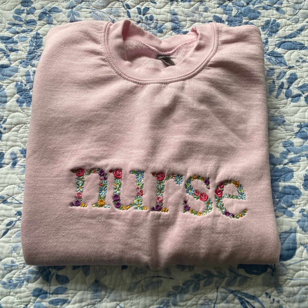 Embroidered “nurse” crewneck sweater